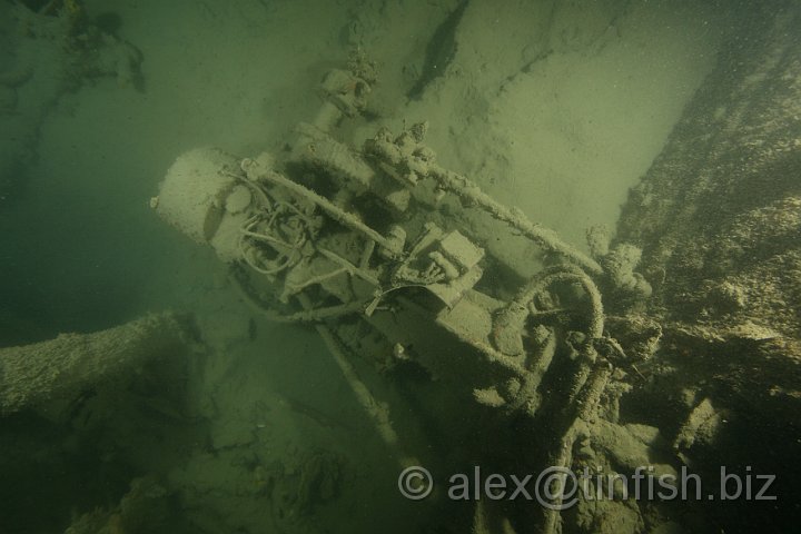 HMS_Encounter-107.JPG - The helm inside the lower deck of the bridge... this room had a huge shell entry hole