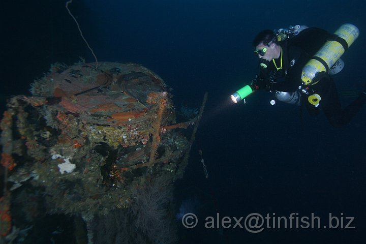 USS_Aaron_Ward-252.JPG - Colin inspects the search light