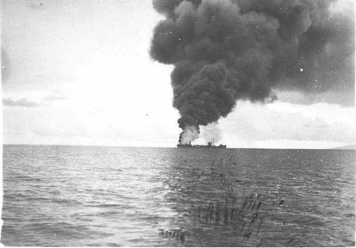 kanawha-photo4.jpg - USS Kanawha (AO-1) on fire at Tulagi Harbor, Solomon Islands, 7 April 1943 after being attacked by Japanese aircraft.