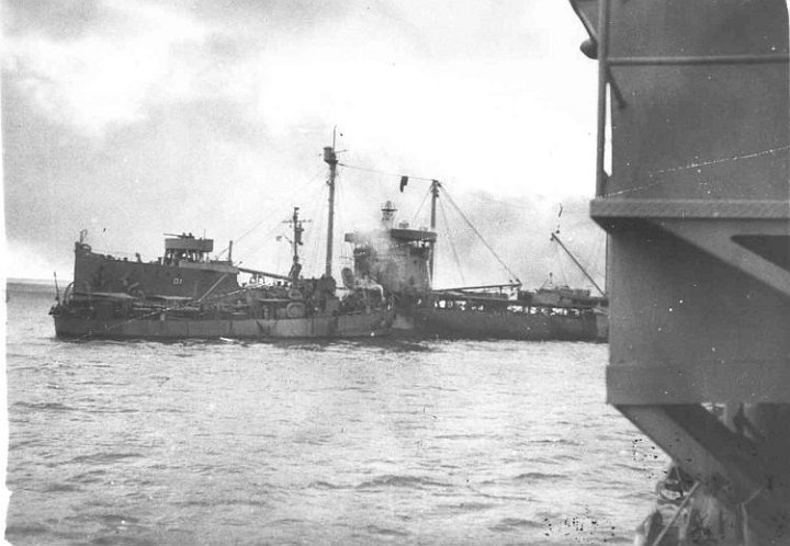 kanawha-photo6.jpg - USS Kanawha (AO-1) on fire at Tulagi Harbor, Solomon Islands, 7 April 1943 after being attacked by Japanese aircraft.