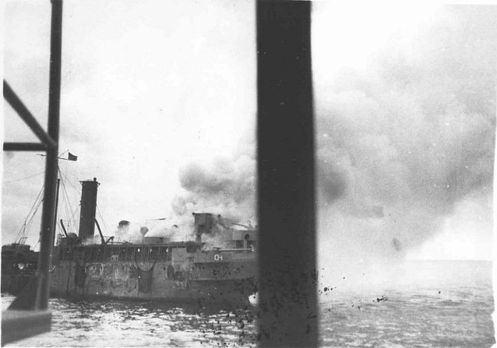 kanawha-photo8.jpg - USS Kanawha (AO-1) on fire at Tulagi Harbor, Solomon Islands, 7 April 1943 after being attacked by Japanese aircraft.